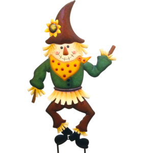 Dancing scarecrow figurine with a tall brown hat, green shirt, yellow scarf, and sunflower on the hat.