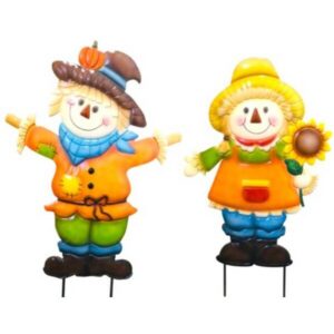 Two cheerful scarecrow figures in autumn outfits, a boy on the left with a pumpkin hat and blue scarf, and a girl on the right holding a sunflower.
